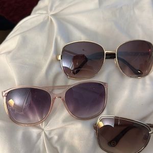 Four sunglasses Target MKors Jessica Simpson fossil cases Oakley two fossil